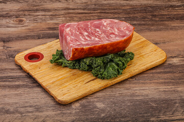 Beef ham piece over board