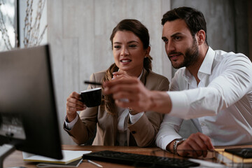 Businessman and businesswoman in office. Businesswoman and businessman working on the project