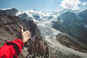 hiker with backpack standing in the mountains