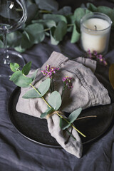 Festive table setting with floral decor. The concept of Thanksgiving or wedding dinner.