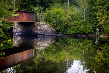 landscape picture of overpass on crystal clear lake