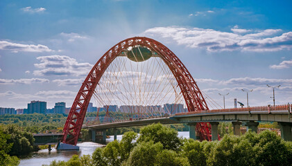 Picturesque or Zhivopisny bridge over the Moscow river on a sunny day. The Red Arch of the Picturesque Bridge