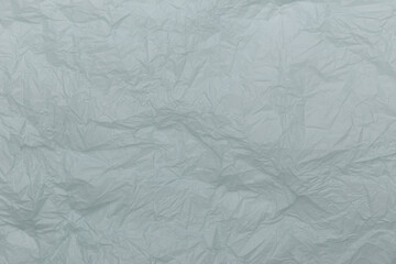 Crumpled blue paper background isolated