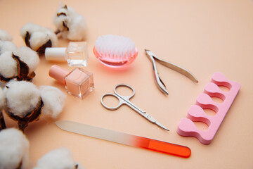 Nail care concept. Professional steel manicure tools on pink table. Beauty.