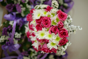 Wedding flowers, bridal bouquet closeup. Decoration made of roses, peonies and decorative plants, close-up, selective focus, nobody, objects