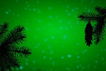 Fototapeta na wymiar Christmas holiday themed texture with pine tree branches and a pine cone on green background with snowflakes like blurred light spots