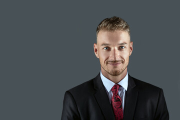 man in black studio portrait suit