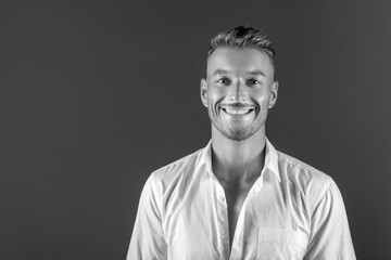 portrait of a handsome man in a white shirt in the studio