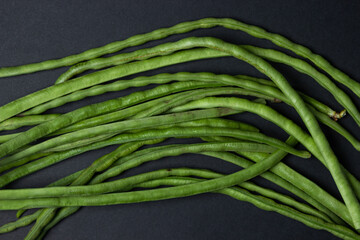 green beans on a black background. Harvesting. Home cooking