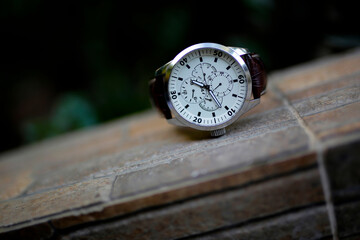 businessman checking time on his wrist watch, man putting clock on hand,groom getting ready in the...