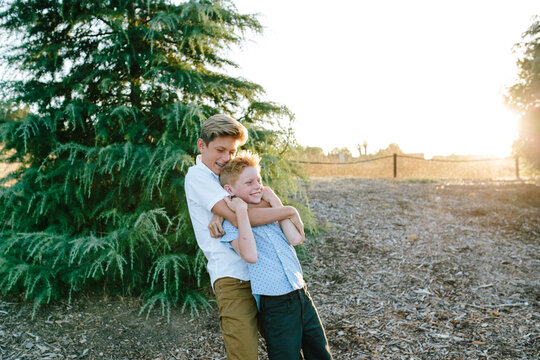 Older Teen Brother Gives Little Brother A Chokehold Hug