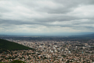 Fototapeta premium Cityscape. Aerial view of the town Salta at the foot of the mountain.