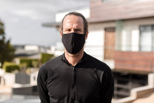 Man wearing black fabric mask