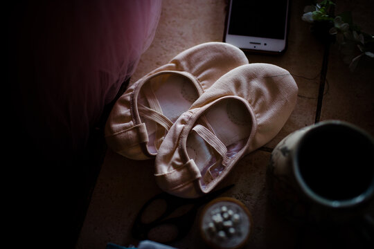 Ballet shoes sitting on table
