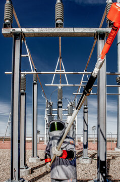 Electric technician in wind farm transmission area