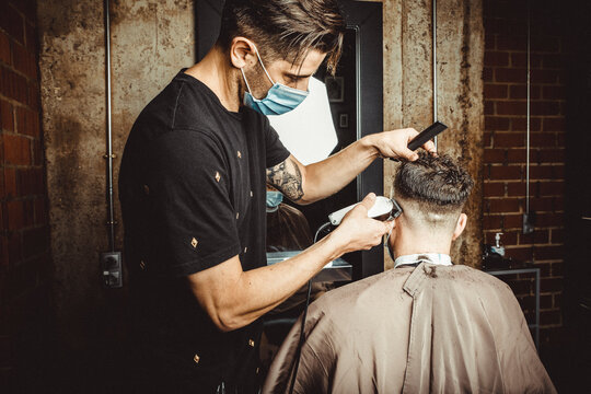 beautician and hairdresser working with mask for the covid19 virus