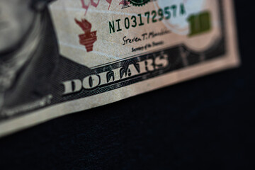 Selective focus on detail of 10 dollars banknote. Close up macro detail of money banknotes, dollars...