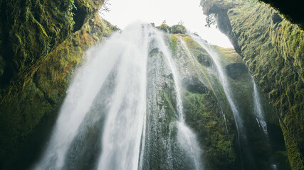 Gljufrabui scenic canyon waterfall with green mossy walls