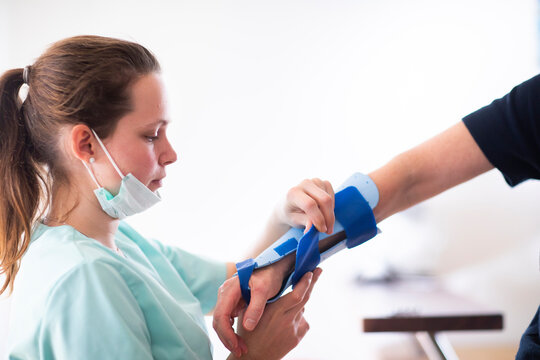 nurse making a armbracer to a patient female