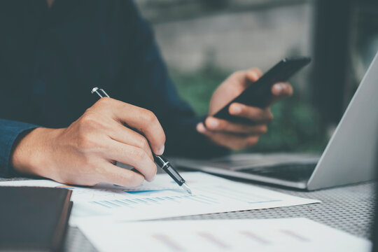 Closeup businessman working with modern device