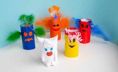 White bull and monsters from toilet paper rolls. Halloween, carnival and New year concept. Eco - friendly reuse of coils