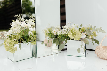 Flowers in the small boxes. Floral decorations. Wedding floral decorations. Flowers composition