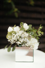 Close up bouquet of white flowers in the small box. Floral decorations. Wedding flowers decorations. Flowers background