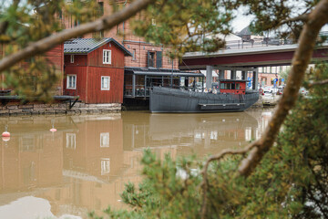 Porvoo, Finland, 09 August 2020 The Porvoonjoki river embankment and the famous red barns stored goods and exotic delicacies brought from distant lands.