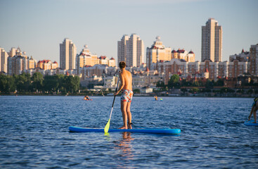 Man on a SUP board in the river