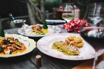 Served table with delicious food and wine