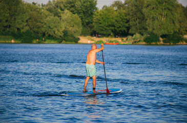 Man on a SUP board in the river