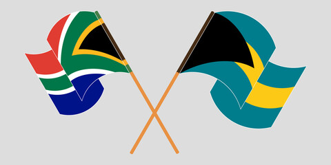 Crossed and waving flags of Bahamas and Republic of South Africa
