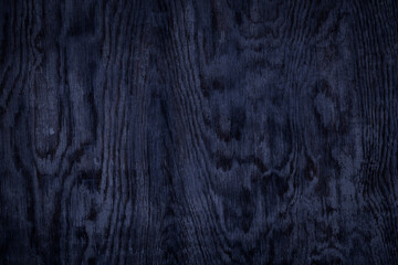 Black dark blue wooden weathered desk board texture. Abstract background, empty template, text space.
