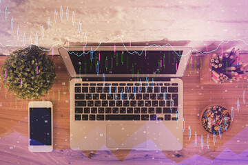 Multi exposure of financial chart drawing over table background with computer. Concept of research. Top view.