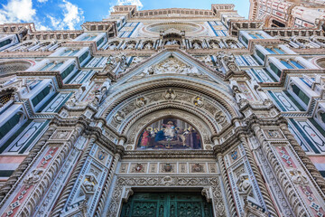 Cathedral Santa Maria del Fiore (or Duomo di Firenze), was built between 1296 and 1436. Cathedral is one of largest in world. Architectural fragments of front facade. Piazza del Duomo, Florence, Italy