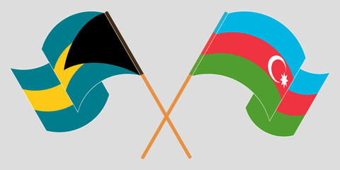 Crossed and waving flags of Bahamas and Azerbaijan