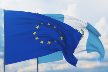 Waving European Union flag and flag of Guatemala. Closeup view, 3D illustration.