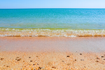 Soft Wave Of Blue Ocean On Sandy Beach. Background. Selective focus