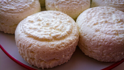 Delicate Circles Of Delicious Cow Cheese Curd Ready To Be Consumed.