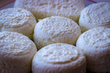 Delicate Circles Of Delicious Cow Cheese Curd Ready To Be Consumed.
