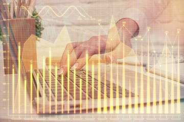 Multi exposure of woman hands typing on computer and forex chart hologram drawing. Stock market analysis concept.