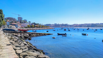 Porto / Portugal - August 25, 2020: Boats at Douro River mouth (Foz do Douro) in a beautiful summer...