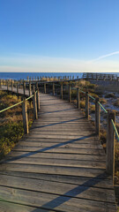 Obraz premium Wooden bridge to the beach at the Northern Litoral Natural Park in Esposende, Portugal.