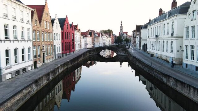 Bruges, Belgium - drone shot of the cityscape/ canal while sunset.