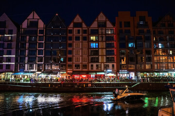 Gdansk, North Poland - August 13, 2020: Night photograph of medieval style polish architecture over...