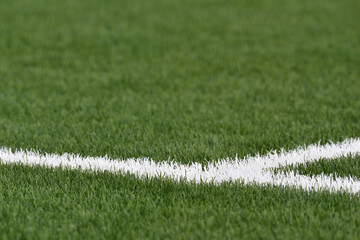 Green football field with nobody