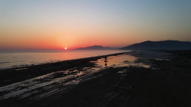 Beach in Andalucia, Spain - drone shot of a beach in Tarifa while sunset.