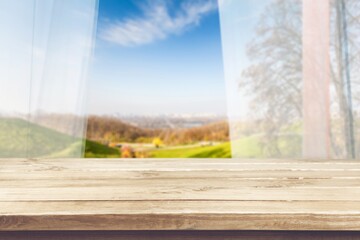 Kitchen wooden table on natural bokeh background
