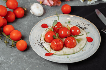 cherry tomatoes with tofu mousse on a plate. place for inscription