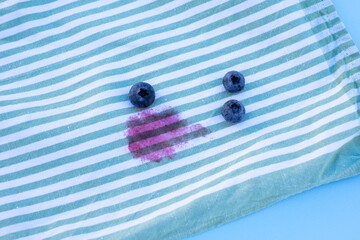 stain blueberry on the tablecloth.isolated on blue background